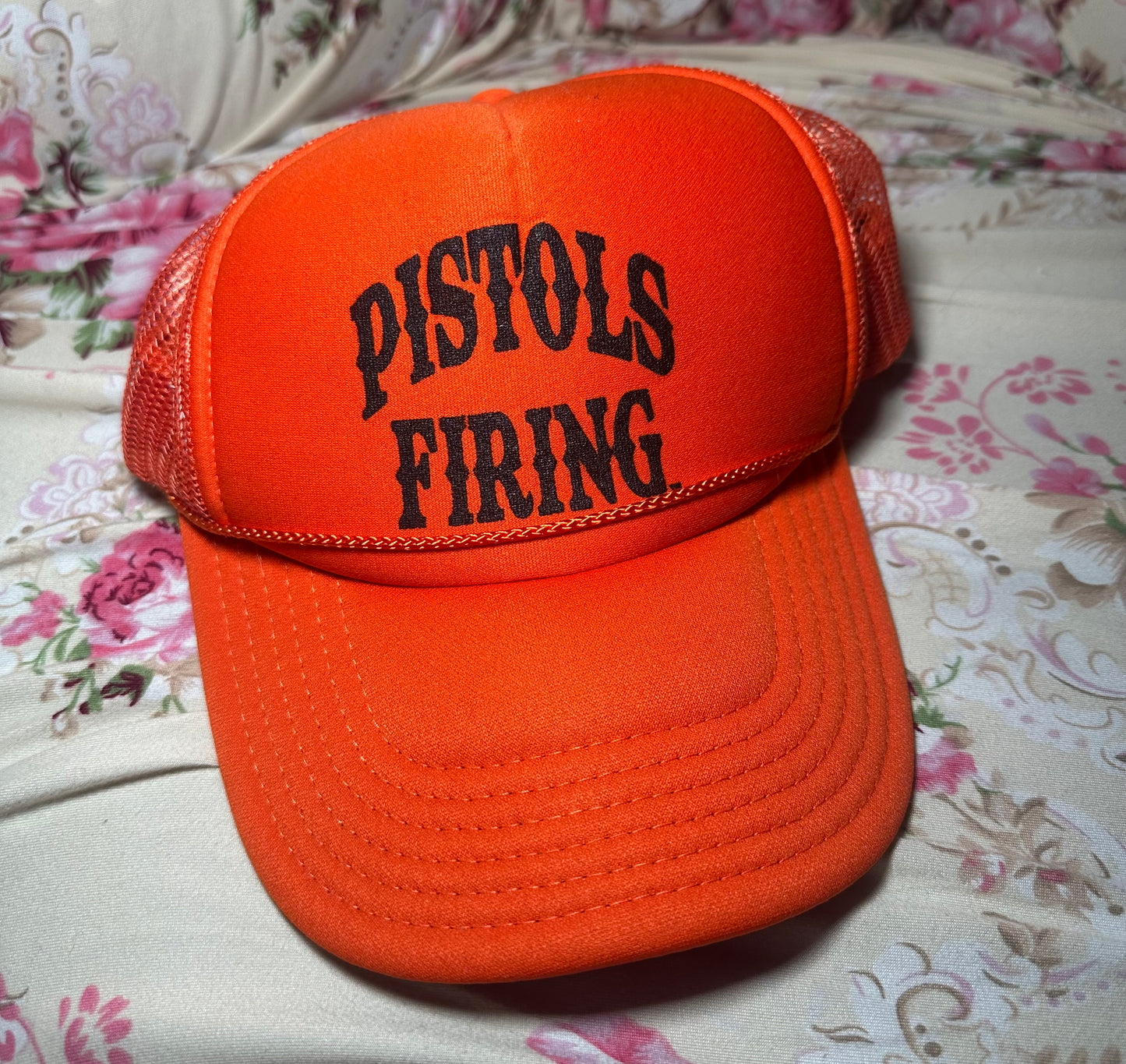 Pistols Firing Trucker Hat